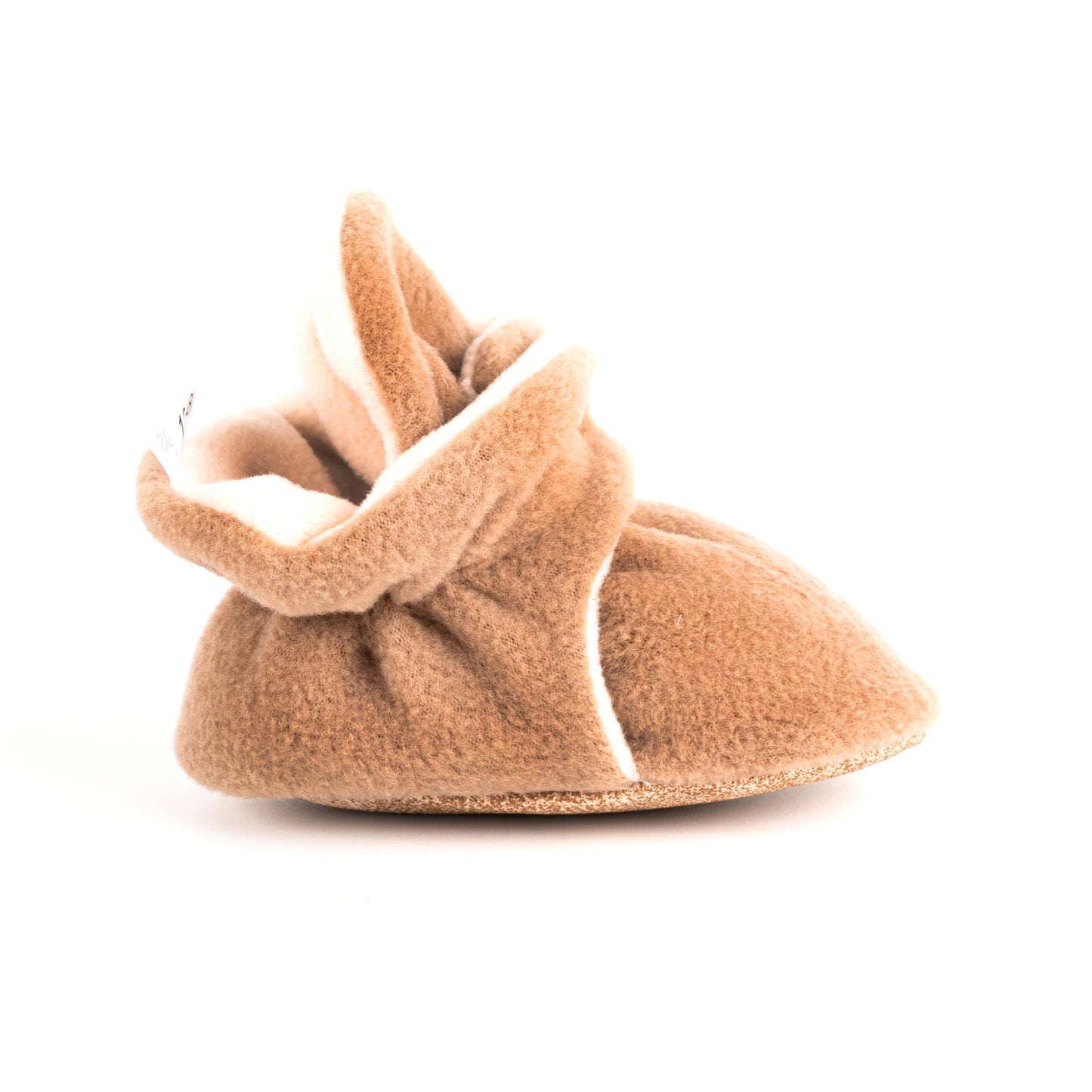 Comfortable and breathable baby booties in latte color with non-slip soles for safe adventures. Left side view.